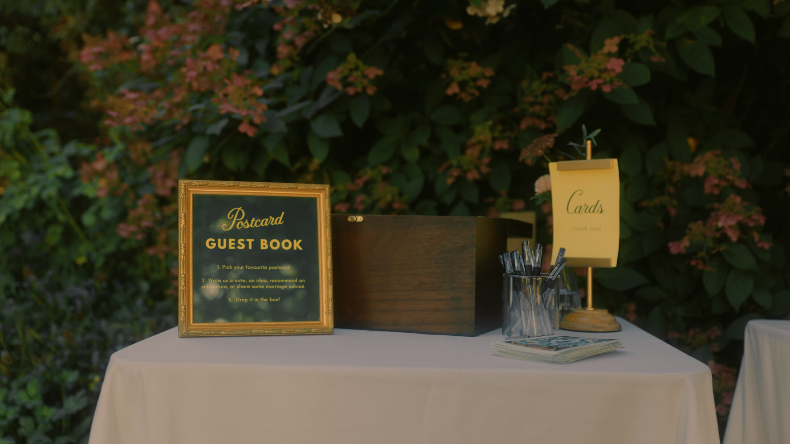 Wes Anderson inspired wedding table guest book and cards signage.