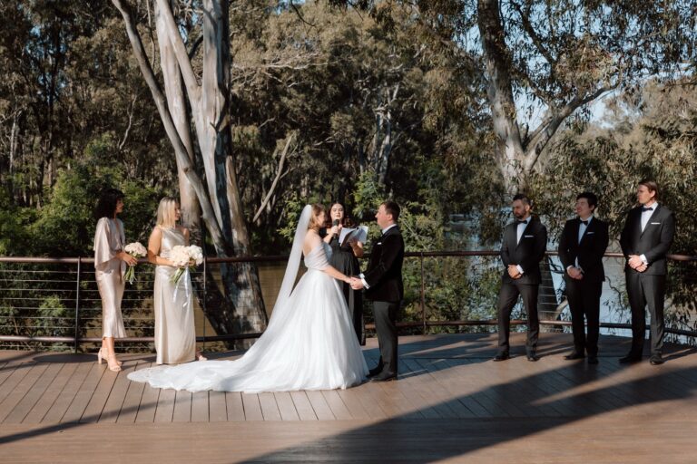 Sarah and Lachie exchange vows at their ceremony at Michelton Wines in Nagambie